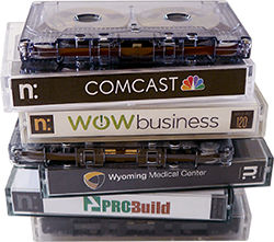 Image of four cassettes: Comcast, WOW business, Wyoming Medical Center, and ProBuild
